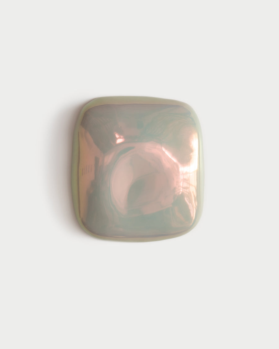 Small iridescent ceramic fragment with pink and green reflections