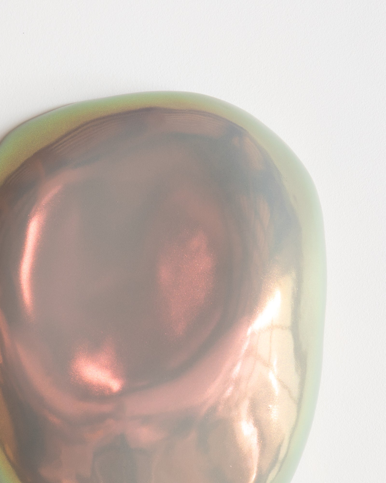 Angled detail of Fragments 11 showing the irregular fragment form and taupe iridescent glaze