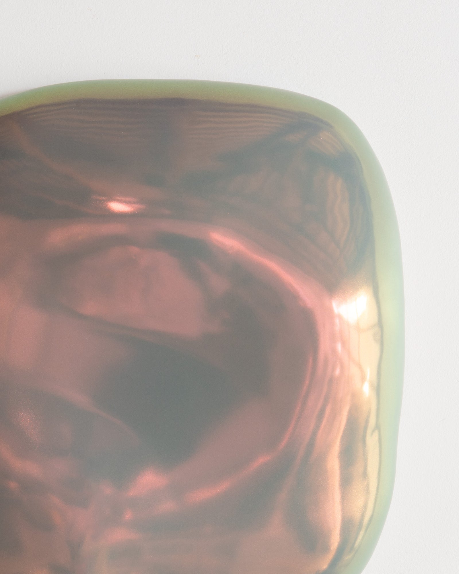 Angled detail of Fragments 15 showing the irregular fragment form and dark taupe iridescent glaze