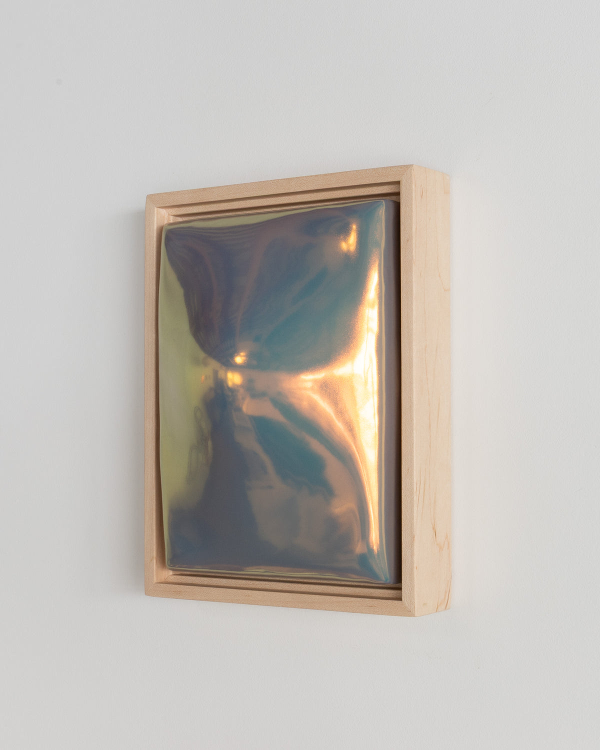 Detail of "Convex" showing the convex raised form and pale blue iridescent glaze