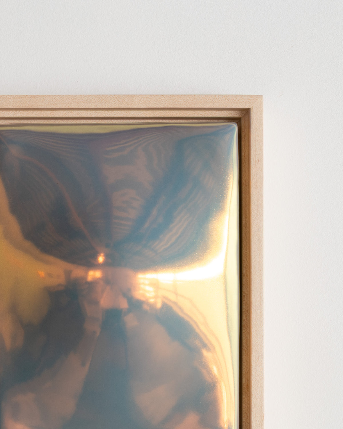 Close-up detail of "Convex" showing the convex raised form and reflective iridescent glaze