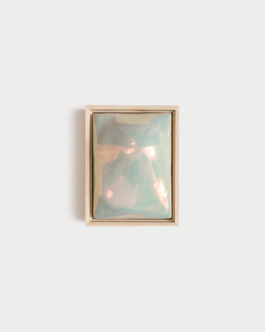 Float 6 x 8 ceramic wall relief with a rounded raised form and light iridescent glaze