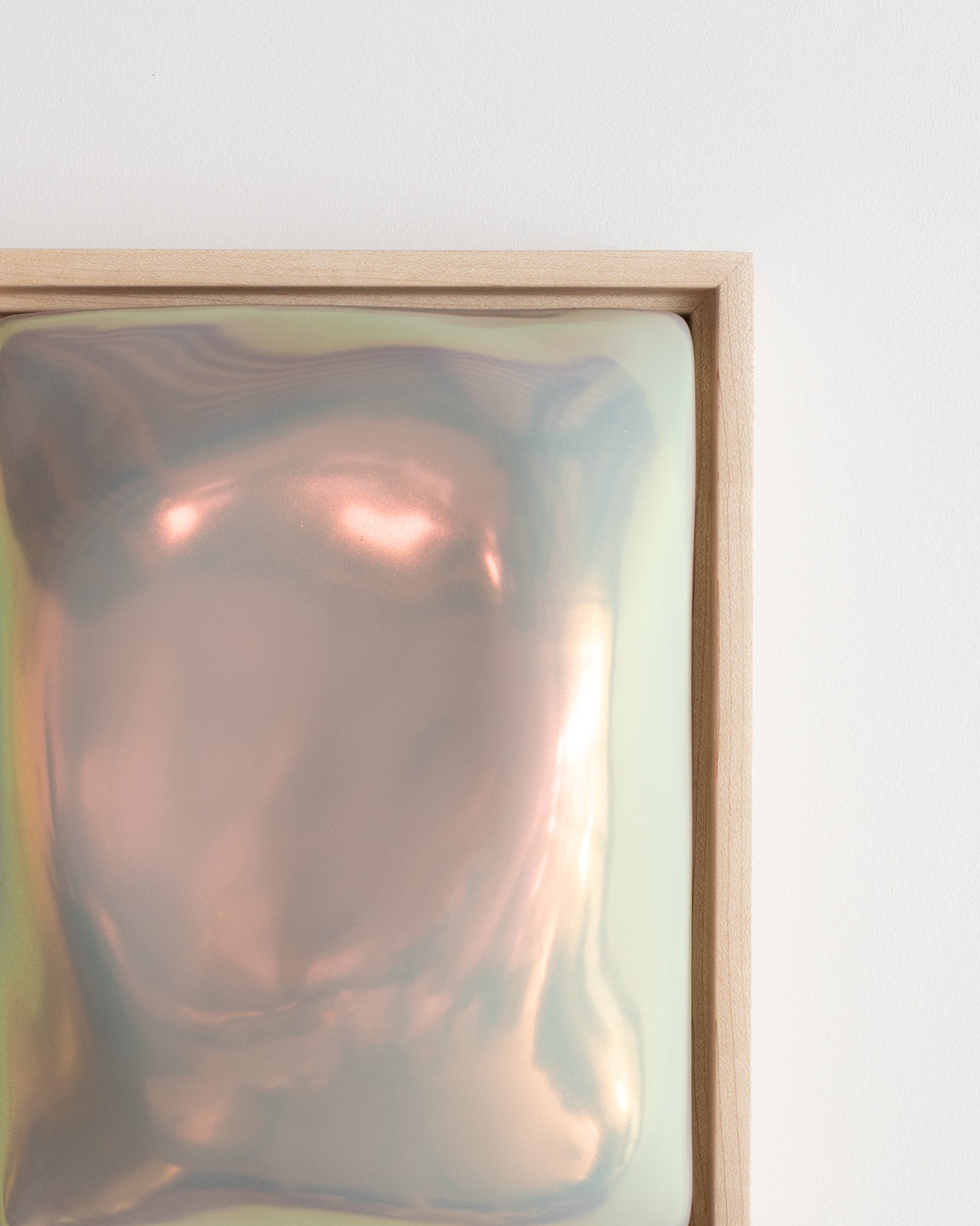 Angled detail of Fold showing the folded raised form and soft taupe iridescent glaze