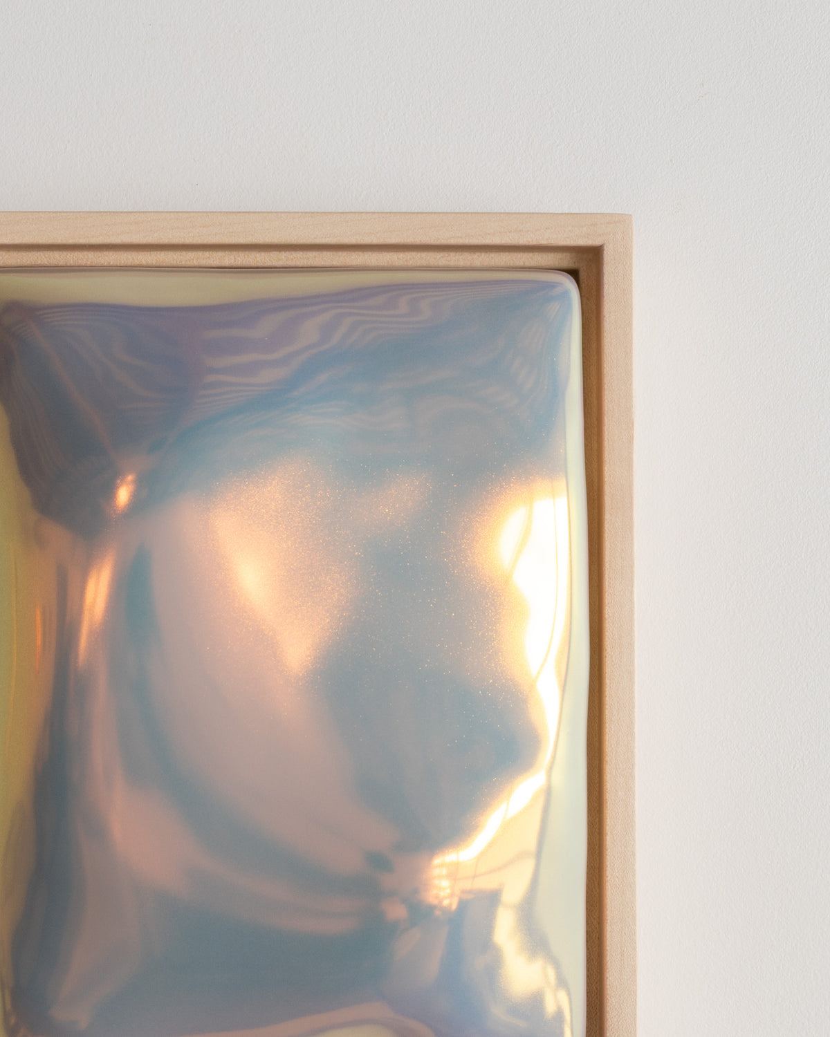 Close-up detail of "Sway" showing the flowing raised form and reflective iridescent glaze