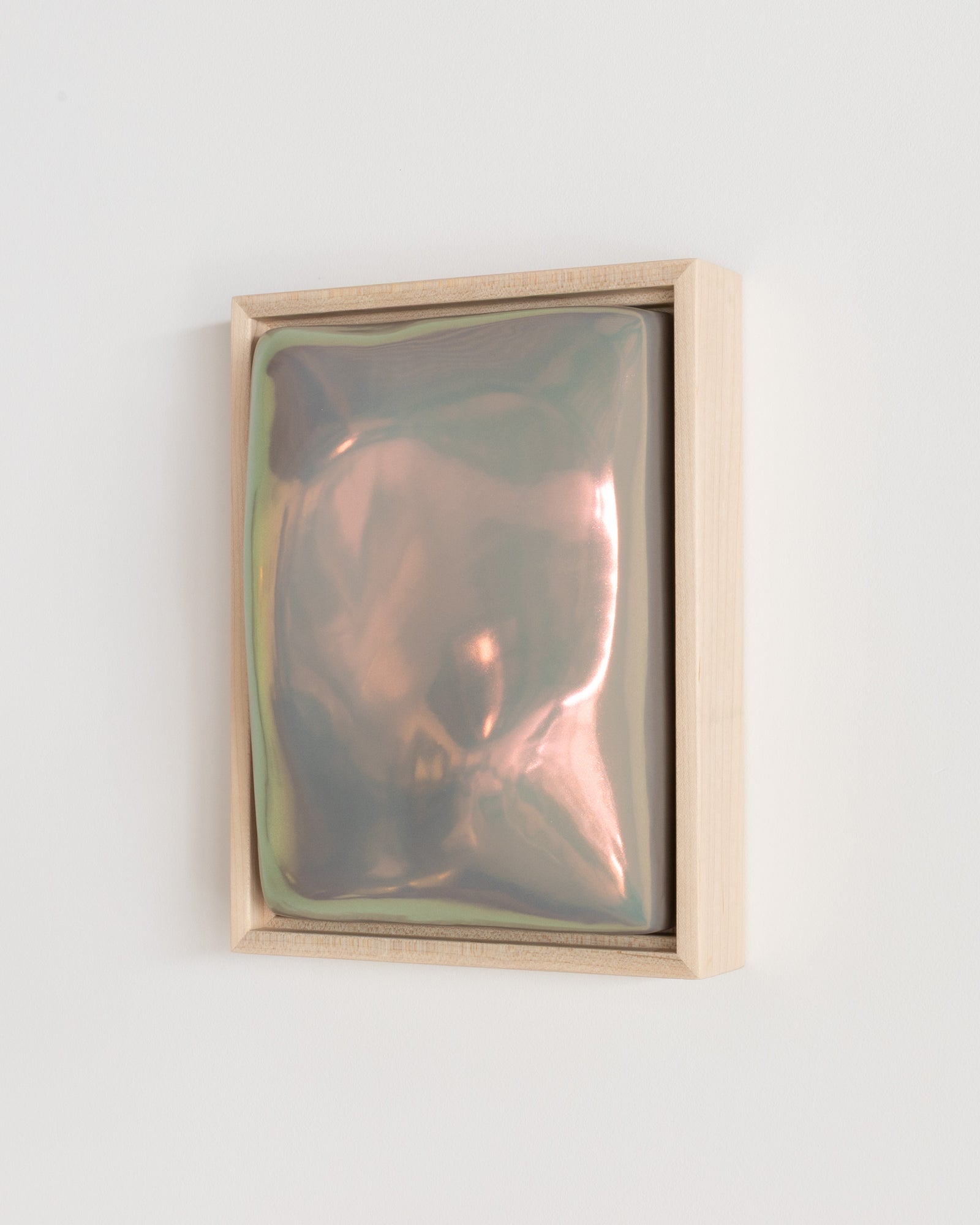 Side detail of Sway showing the framed ceramic wall relief and taupe iridescent glaze