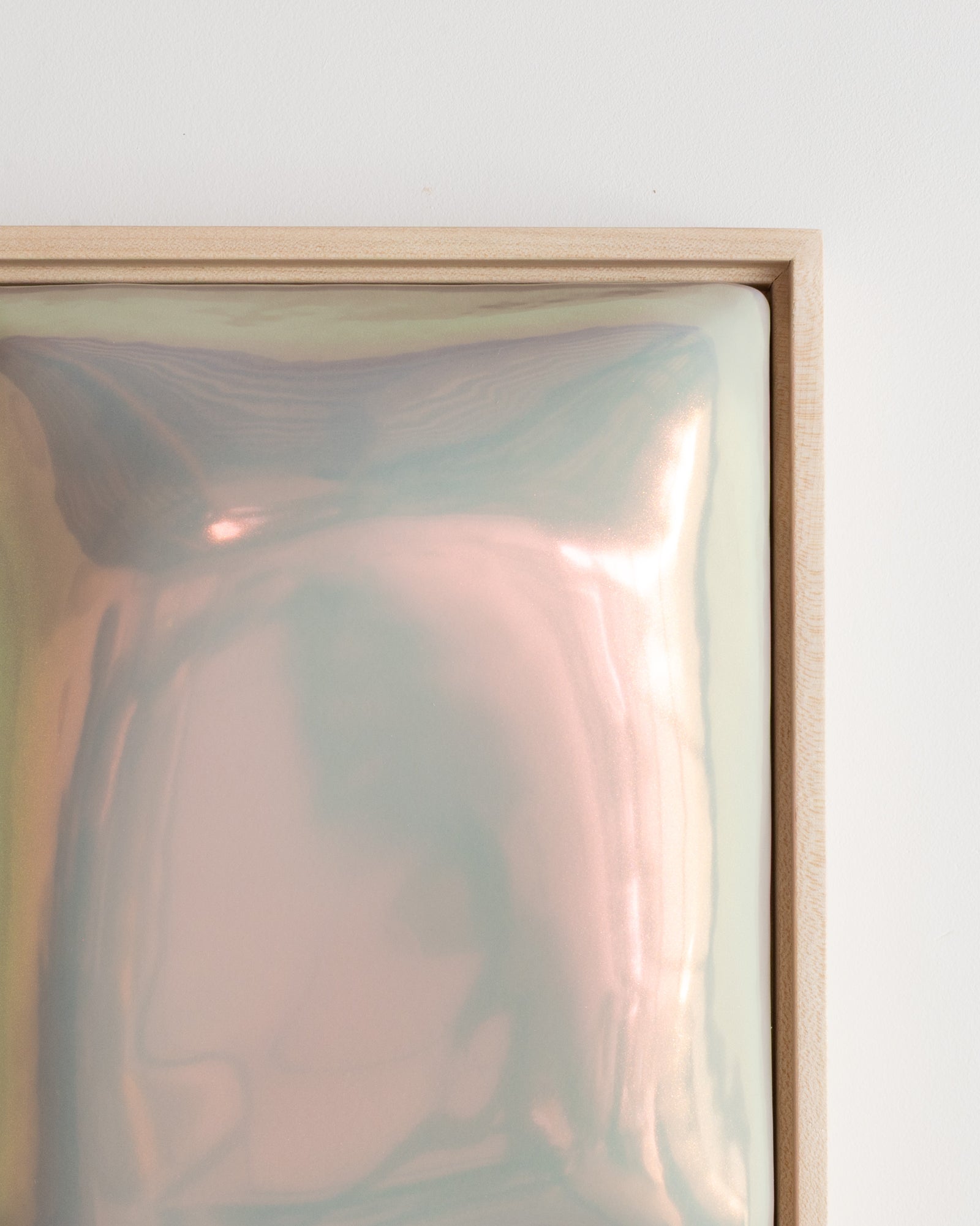 Angled detail of Trace showing the linear raised trace form and soft taupe iridescent glaze
