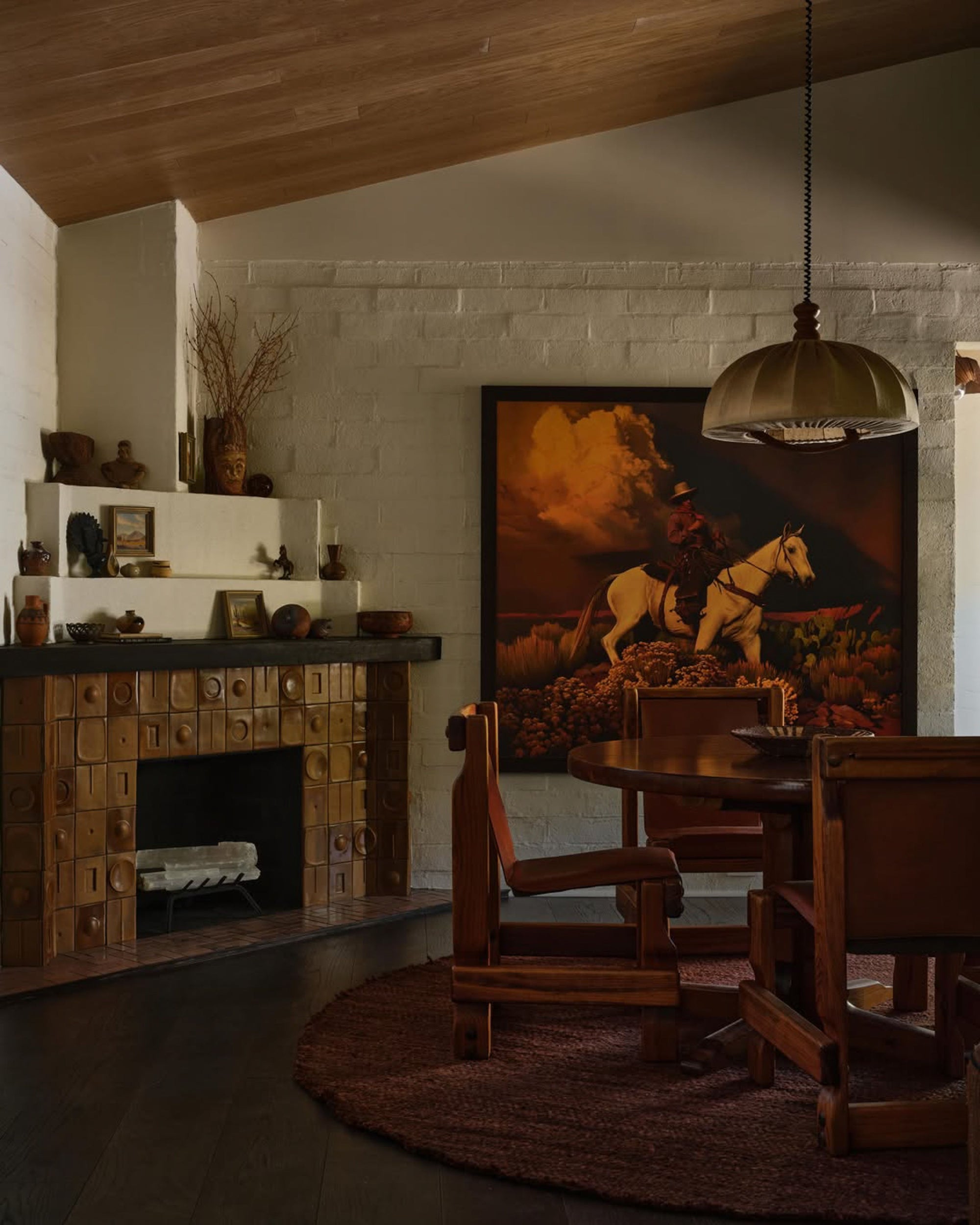 Functional tiles in dining room fireplace. Design by A1000XBetter, photography by Michael Clifforda