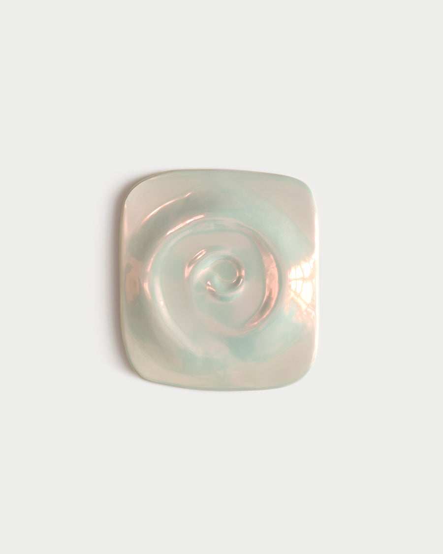 Nautilus 04 ceramic artwork with a raised spiral form and iridescent surface