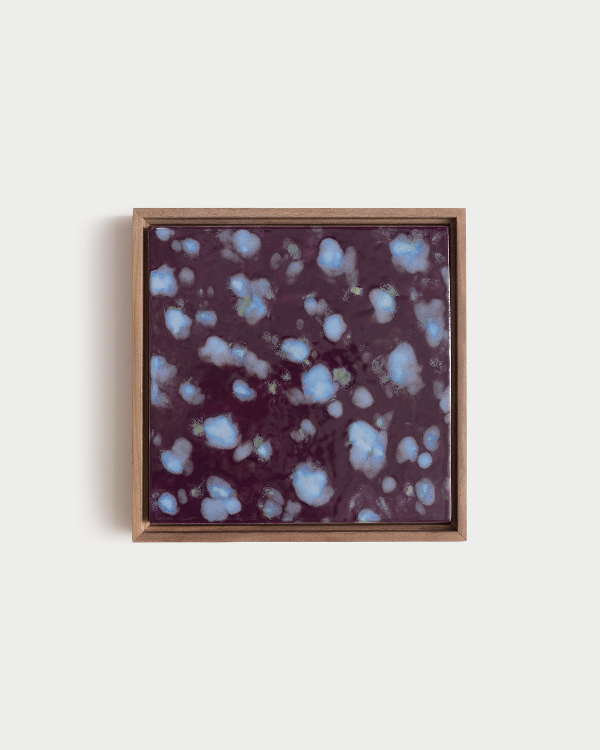 "Snow on Petals" 10x10" framed glaze painting with pale blue petals on a deep burgundy surface