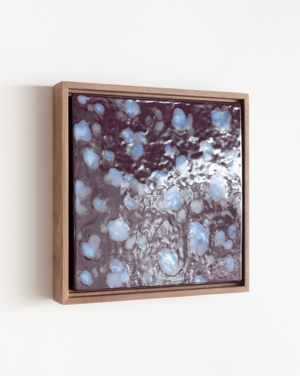 Angled detail of "Snow on Petals" showing glossy glaze over pale blue petals