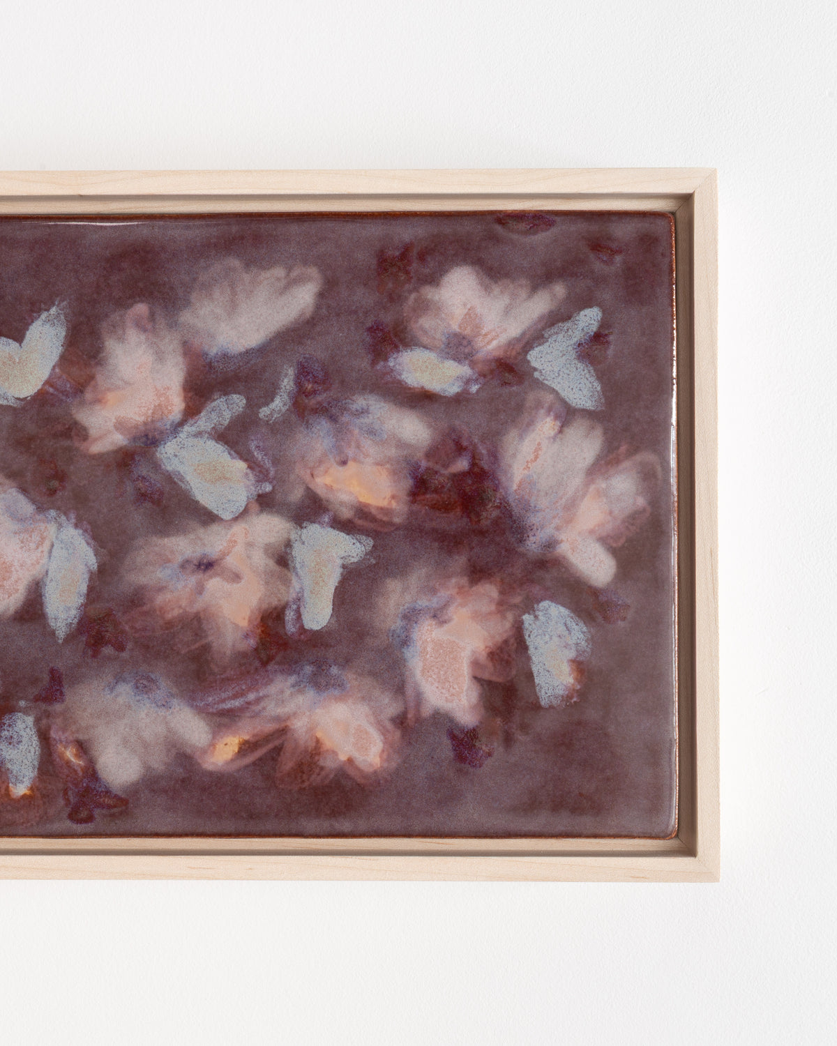 Close-up detail of "Flutter" showing layered pale petal forms on deep burgundy