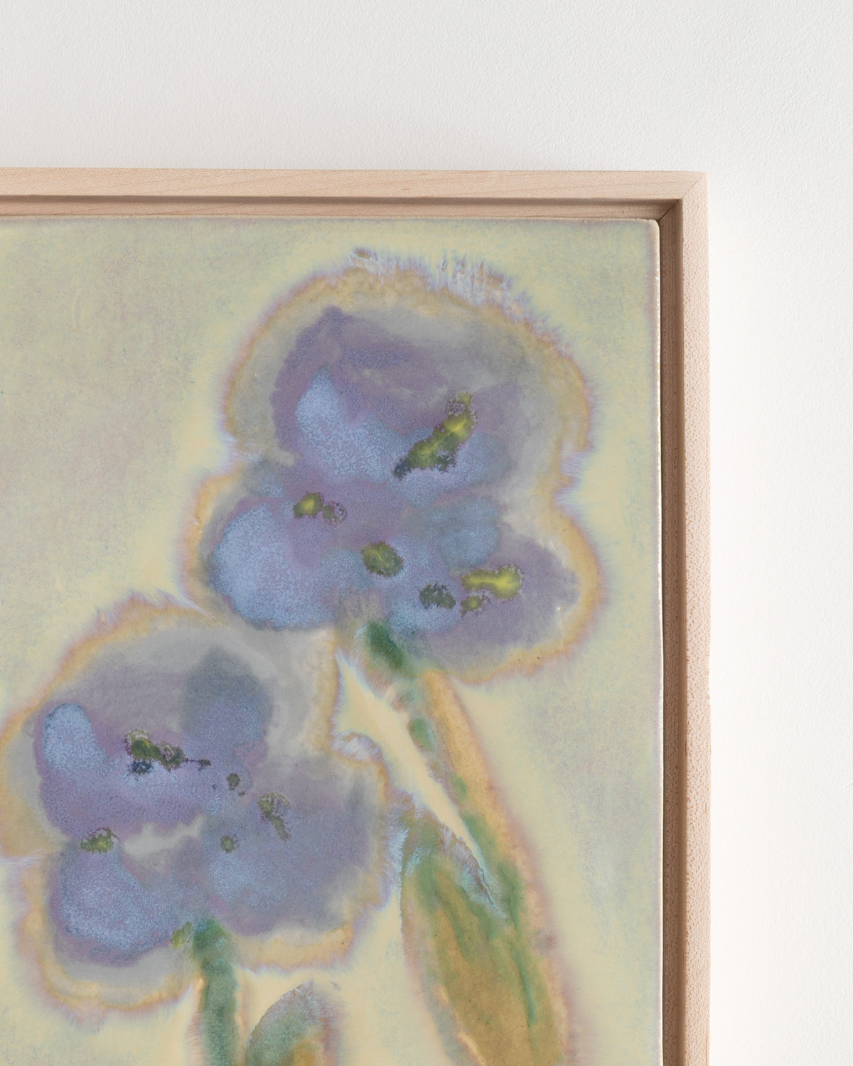 Close-up detail of "A Leaning" showing layered blue petals and green stems