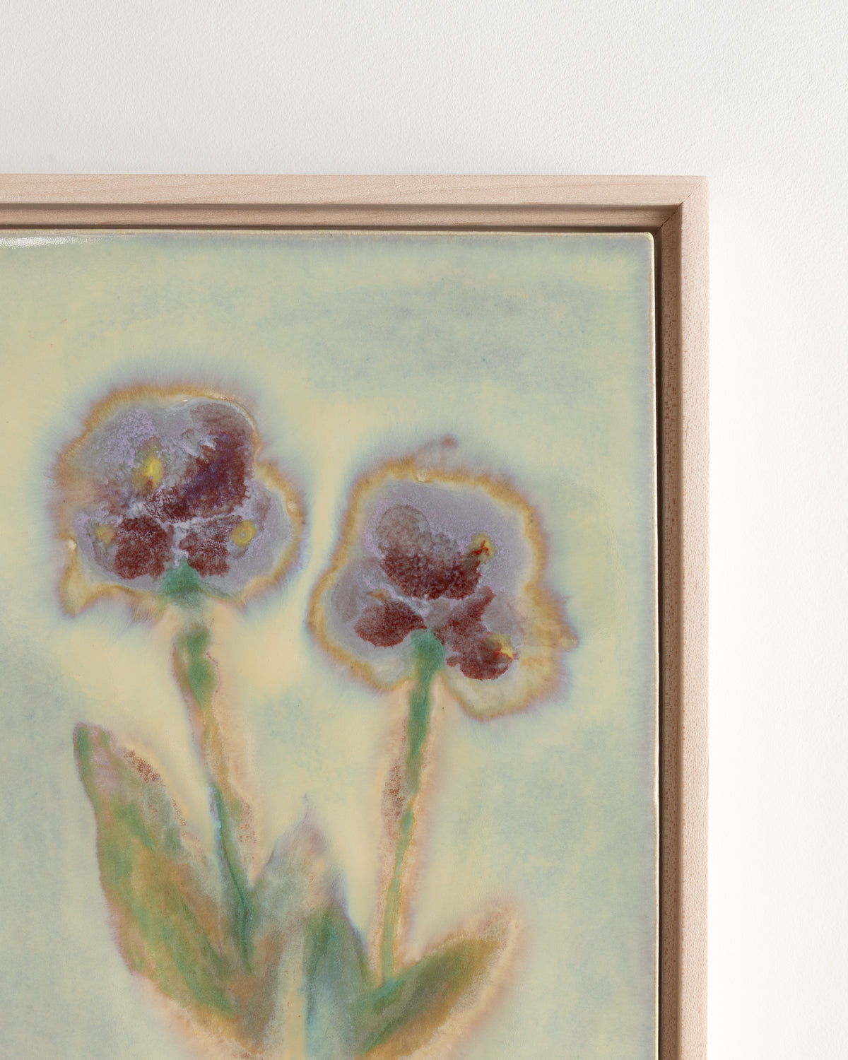 Close-up detail of "Between You and Me" showing burgundy blossoms and green stems
