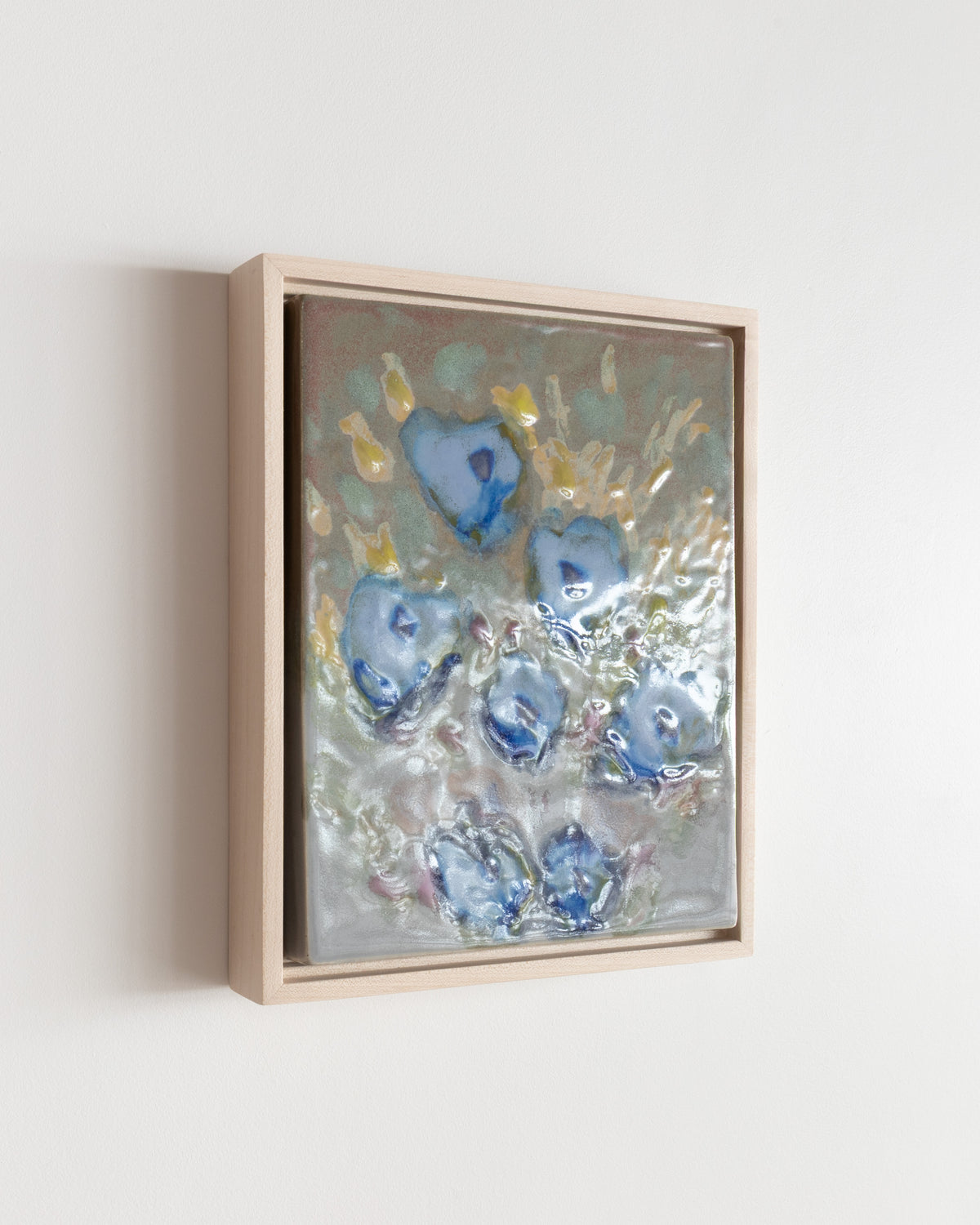 Angled detail of "Meadow" showing glossy blue flowers and yellow marks