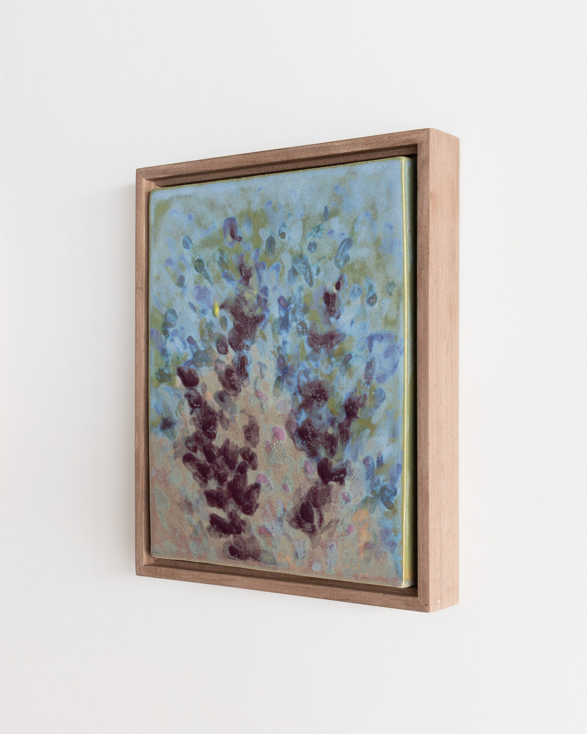 Detail of "Wildflowers" showing blue and burgundy stems on a pale blue-green surface