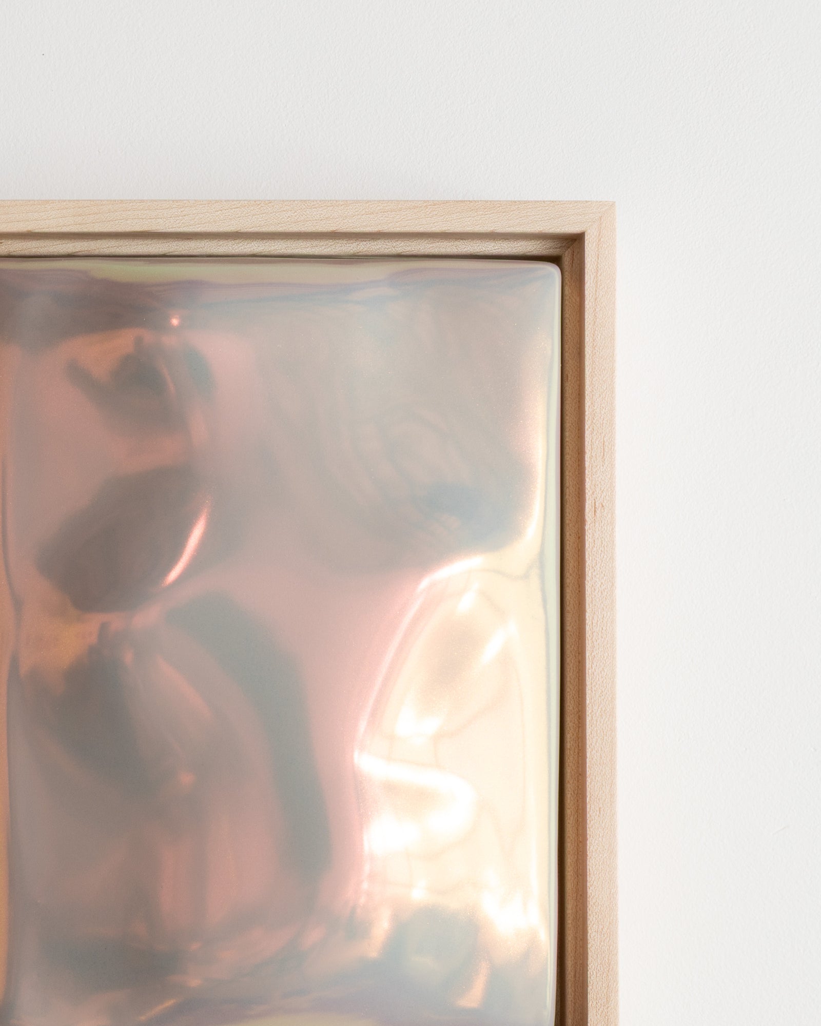 Angled detail of Archive showing the raised abstract form and lilac iridescent glaze