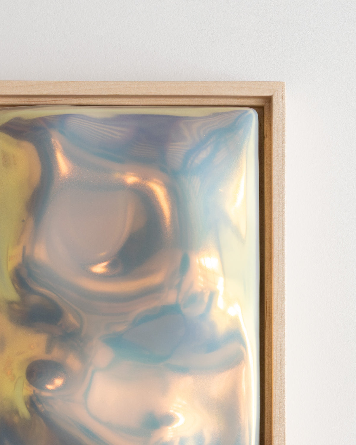 Close-up detail of Flora showing raised organic forms and reflective iridescent glaze