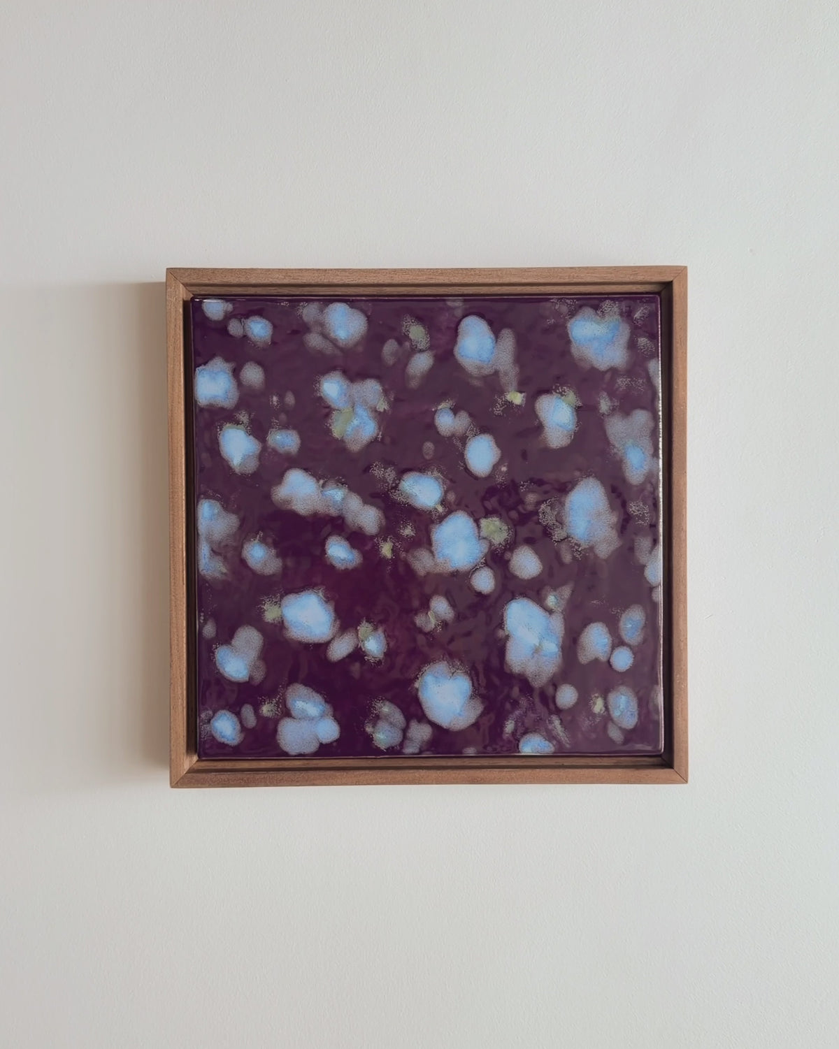 Video of "Snow on Petals" 10x10" framed glaze painting with pale blue petals on burgundy