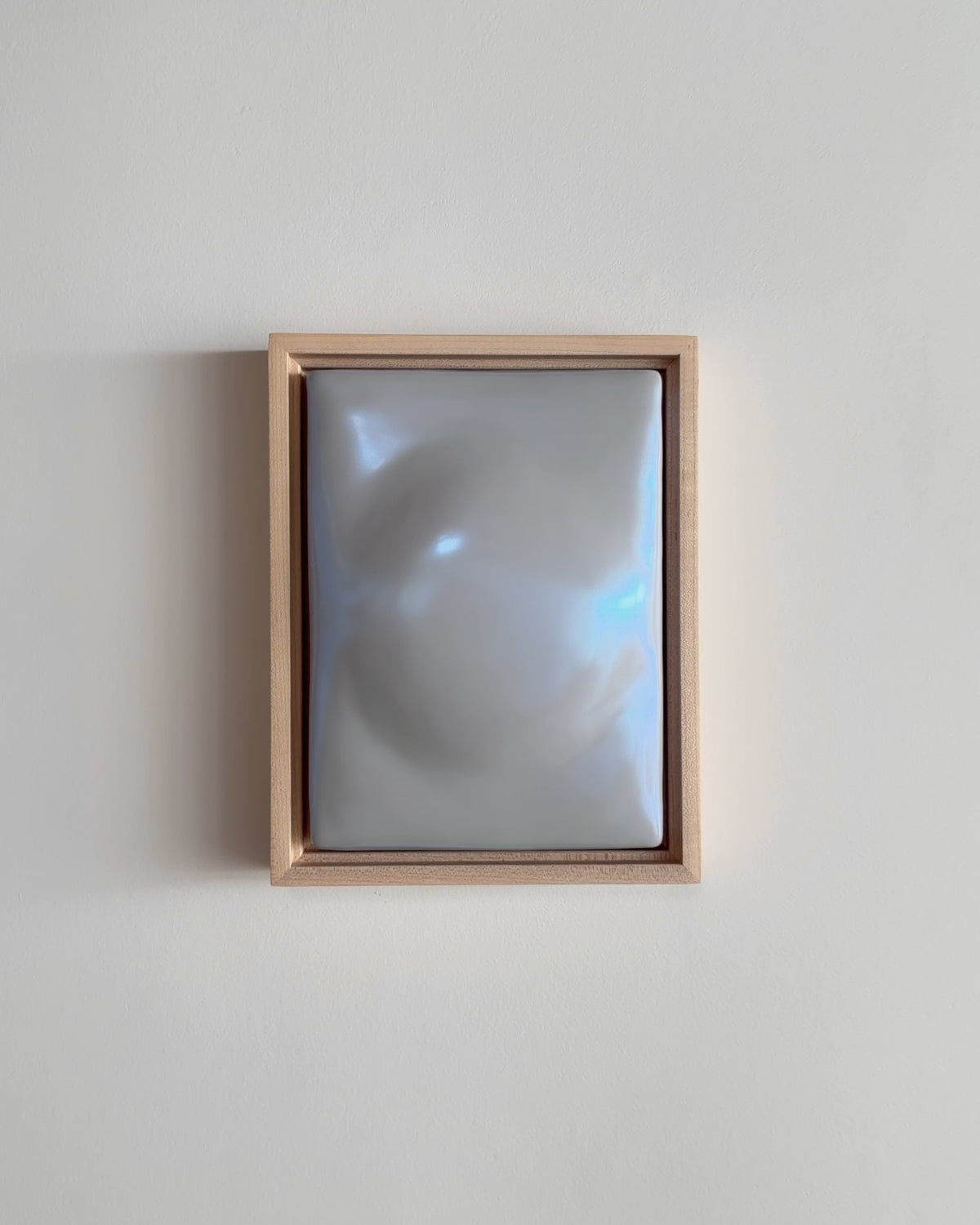 Video thumbnail of a pale blue framed ceramic wall relief