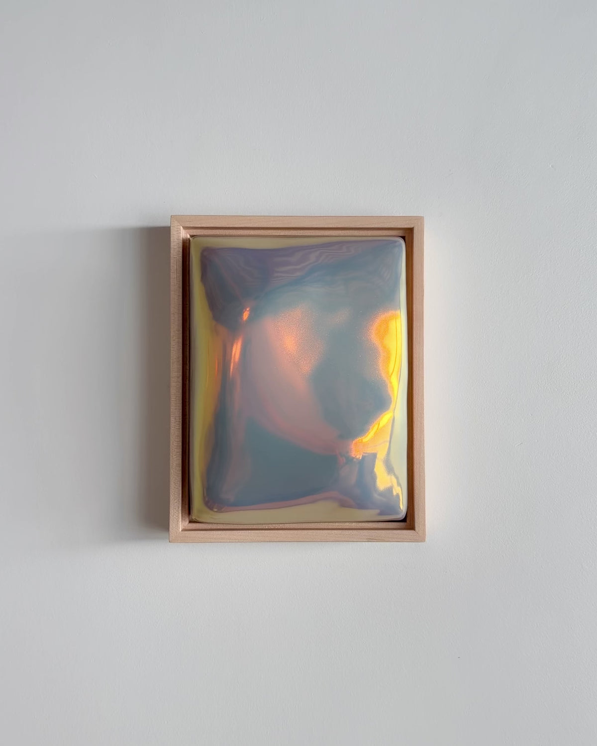 Video of "Sway" 6x8" ceramic wall relief showing a flowing raised form and iridescent glaze