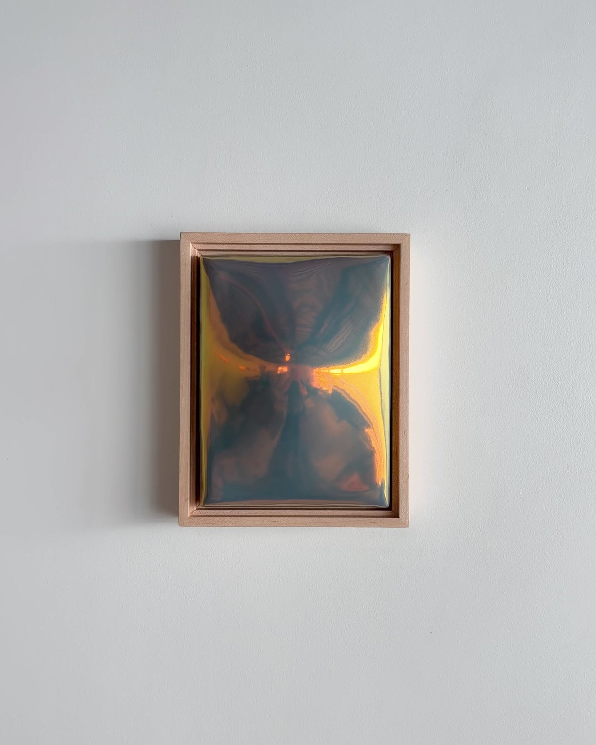 Video of "Convex" 6x8" ceramic wall relief showing a convex raised form and iridescent glaze