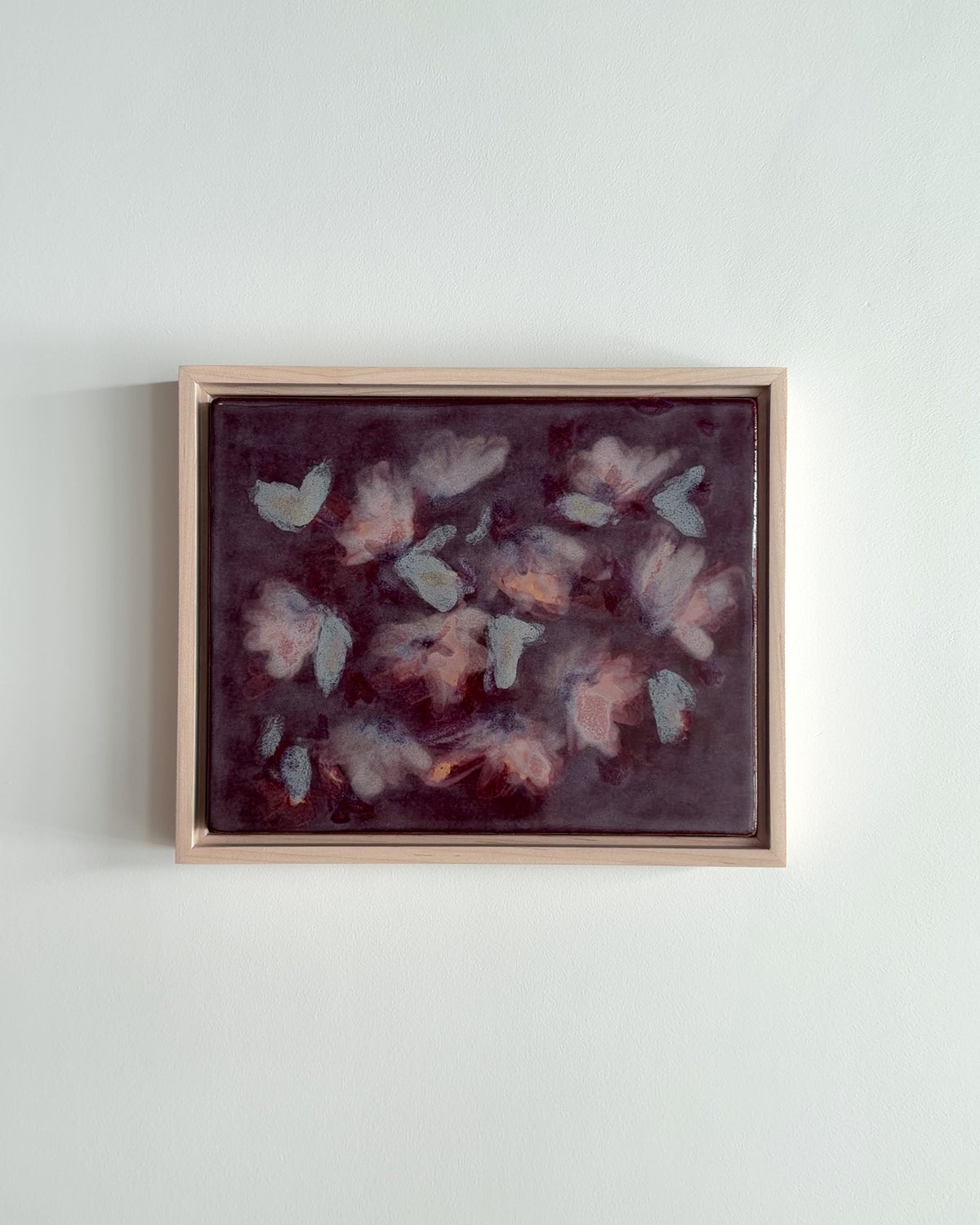 Video of "Flutter" 10x8" framed glaze painting with pale petal forms on deep burgundy