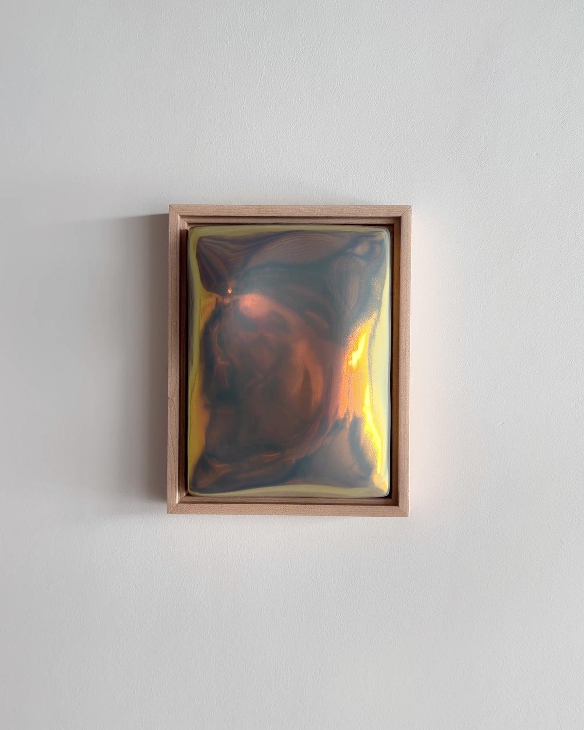 Video of Hold 6x8" ceramic wall relief showing the rounded raised form and iridescent glaze