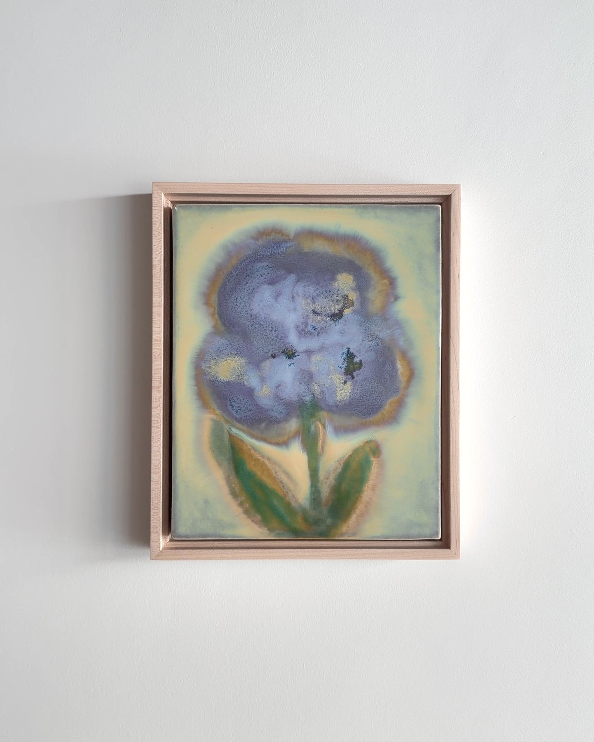 Video of "Pollen" 8x10" framed glaze painting with a large blue flower and green leaves