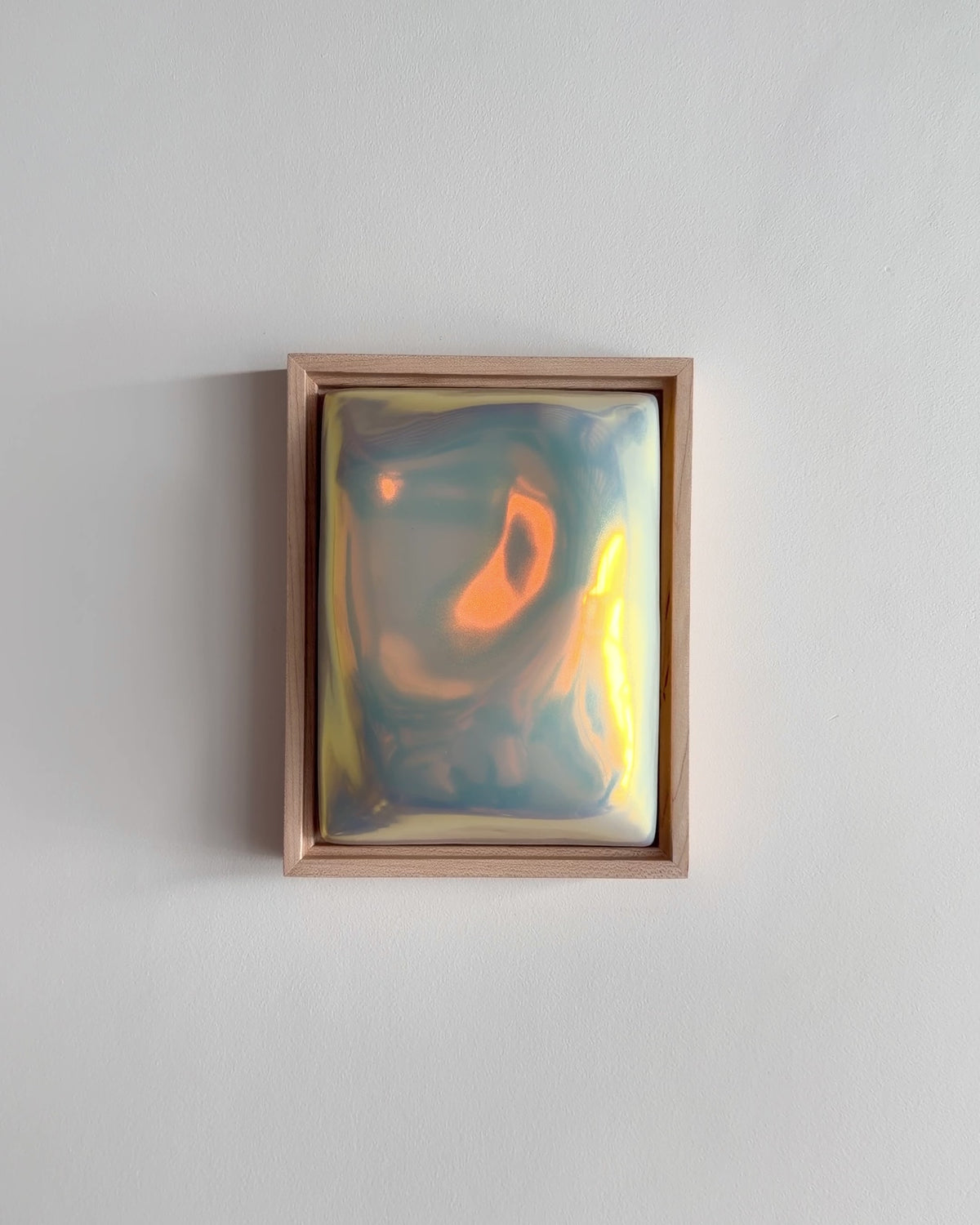 Video of Fold 6x8" ceramic wall relief showing the folded raised form and iridescent glaze