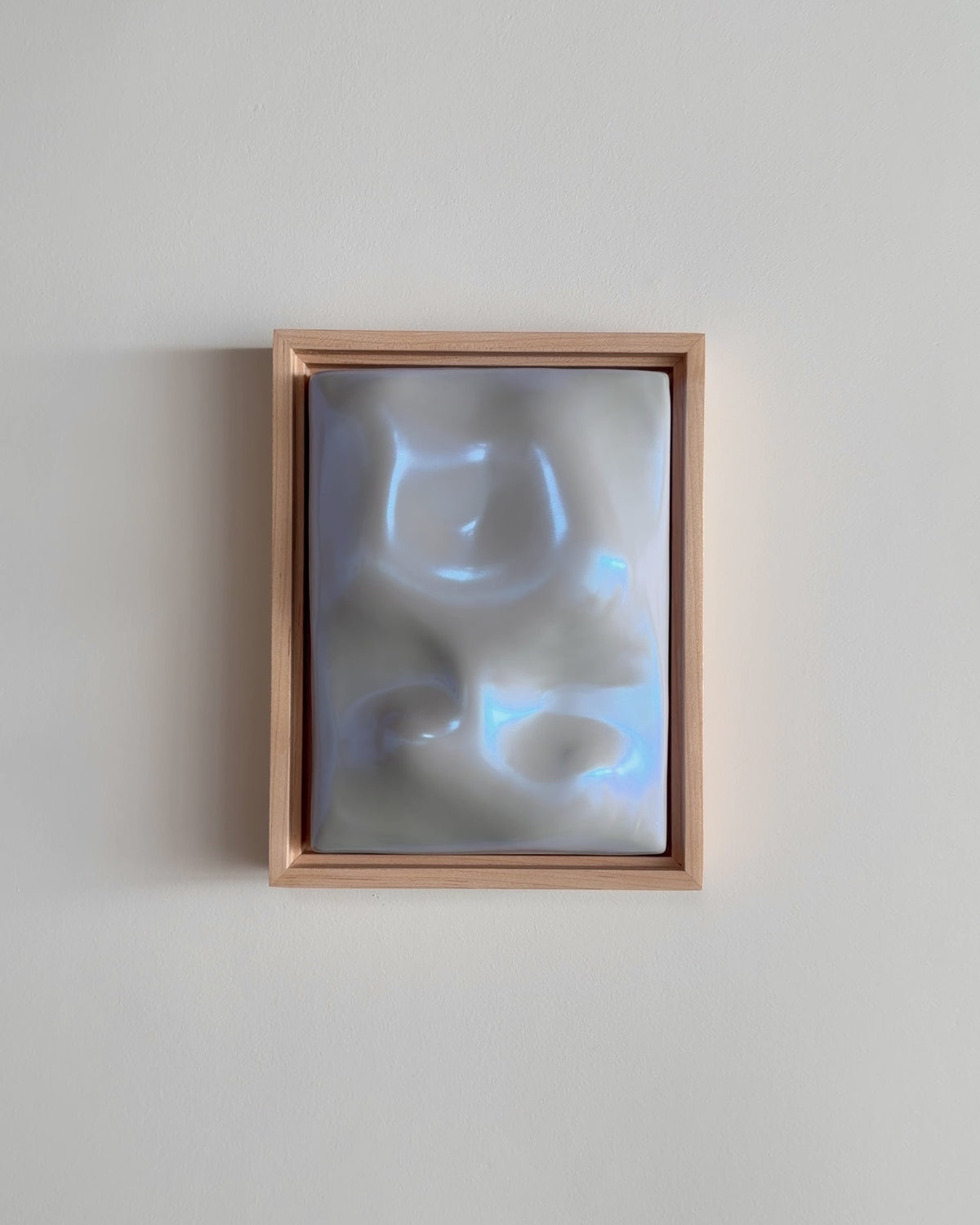 Video thumbnail of a pale blue framed ceramic wall relief