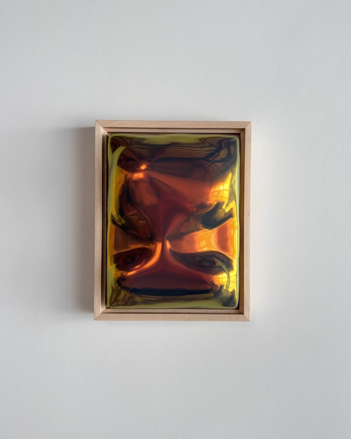 Video of "Artifact" 6x8" ceramic wall relief showing raised abstract forms and iridescent glaze